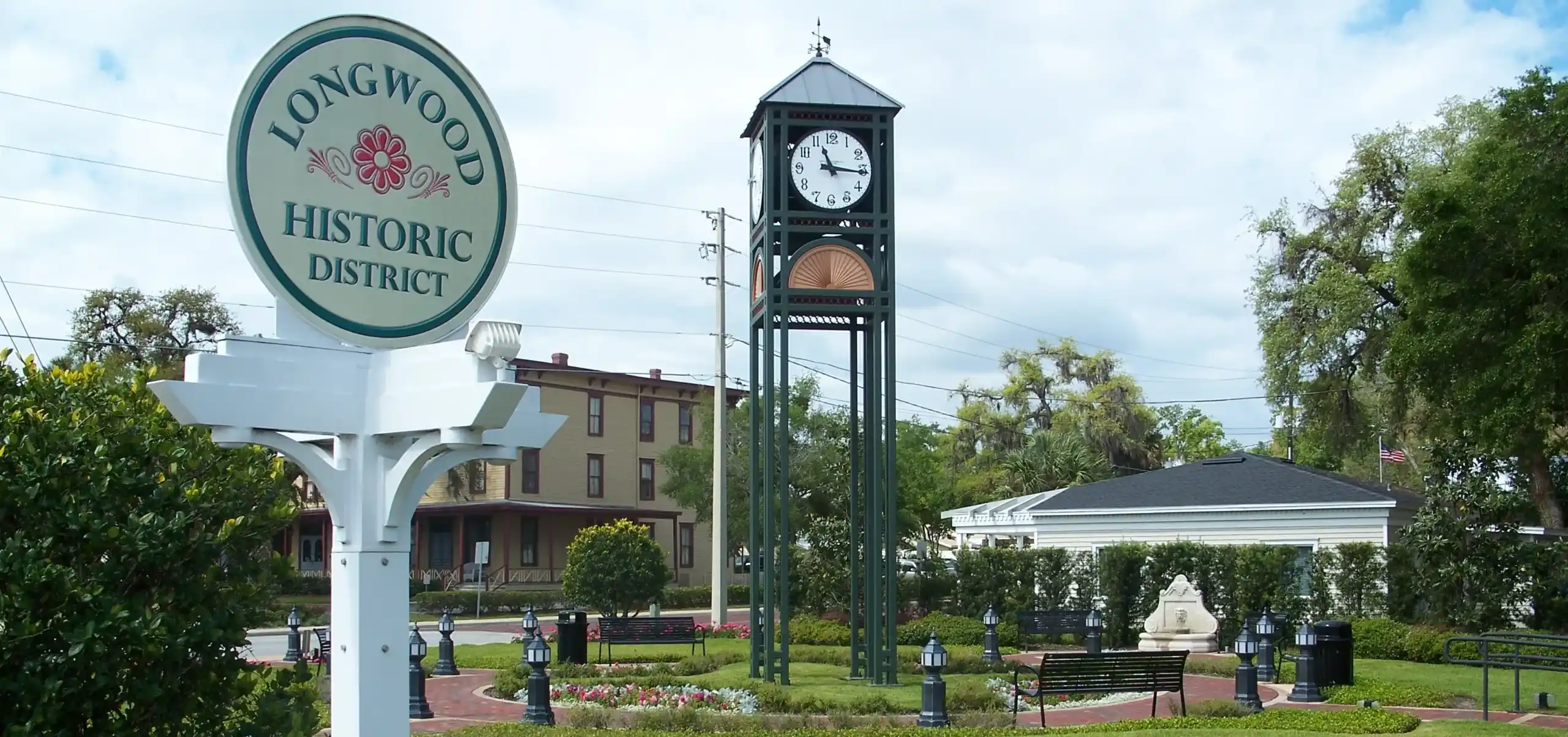 Historic clock tower in Longwood's historic district, symbolizing the charm and heritage of the area, with well-maintained surroundings reflecting the quality services provided by Termite Lawn and Pest.