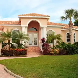 Beautiful home with lush landscaping, highlighting the need to debunk termite myths and protect properties from termite damage.