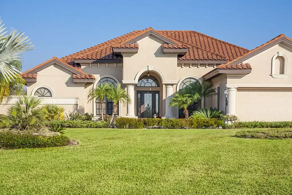 Beautifully maintained lawn in front of a home, showcasing the results of Ocoee lawn care services.