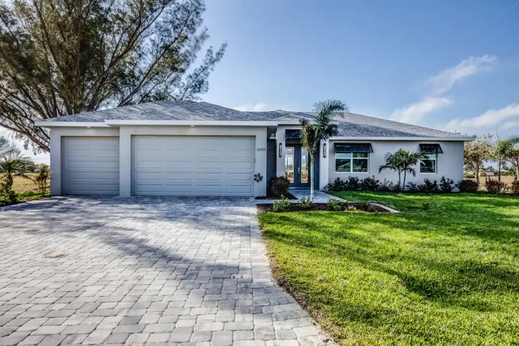 A well-maintained front yard of a modern home in Sanford, highlighting expert lawn care services.