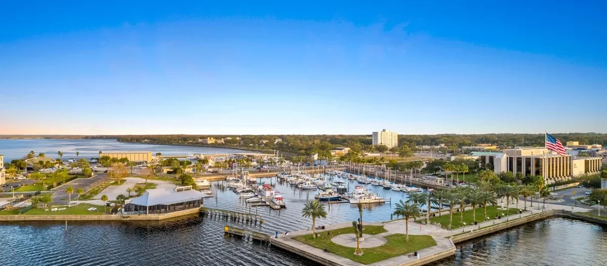 Aerial view of the Sanford marina area, showcasing the beautiful waterfront and well-maintained green spaces, representing the community services available in Sanford.