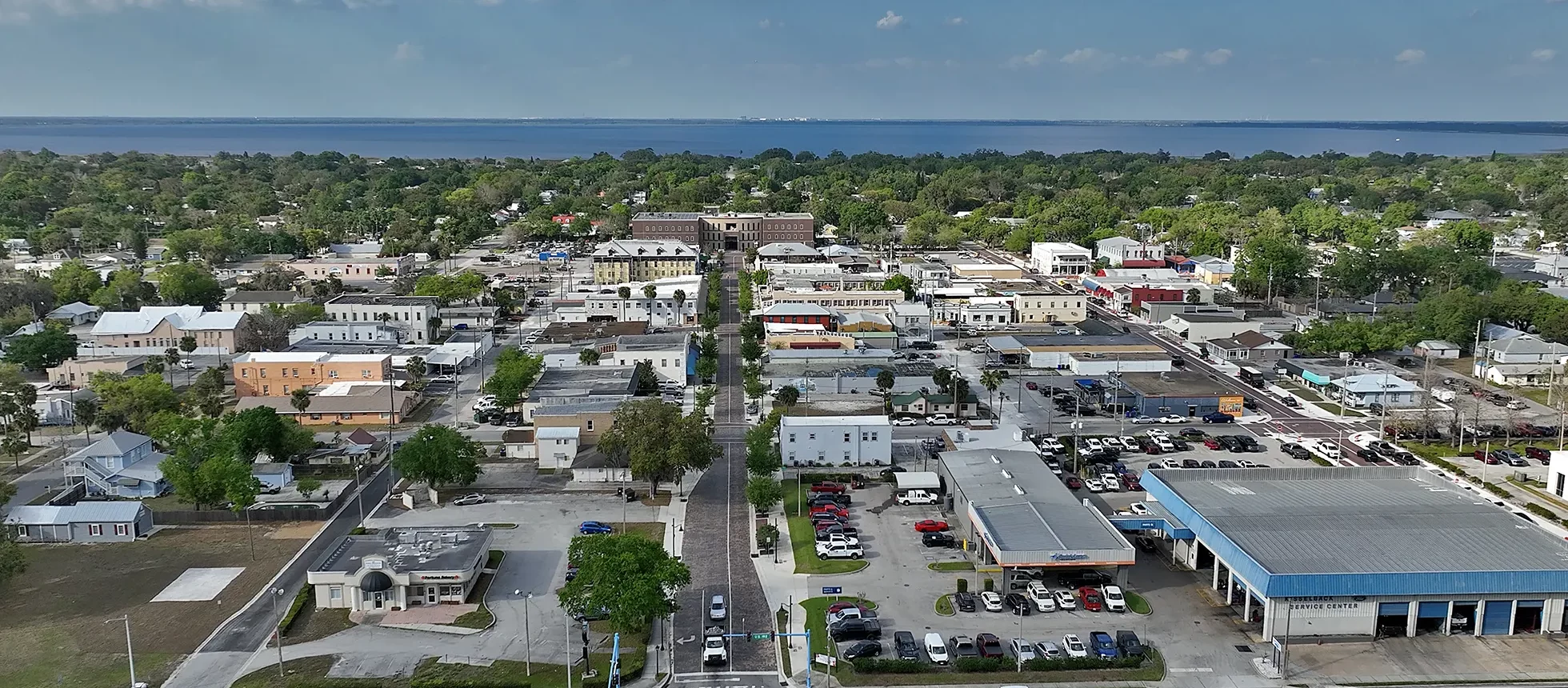 Aerial view of St. Cloud, showcasing residential and commercial areas, highlighting the community where comprehensive lawn care and pest control services are available.